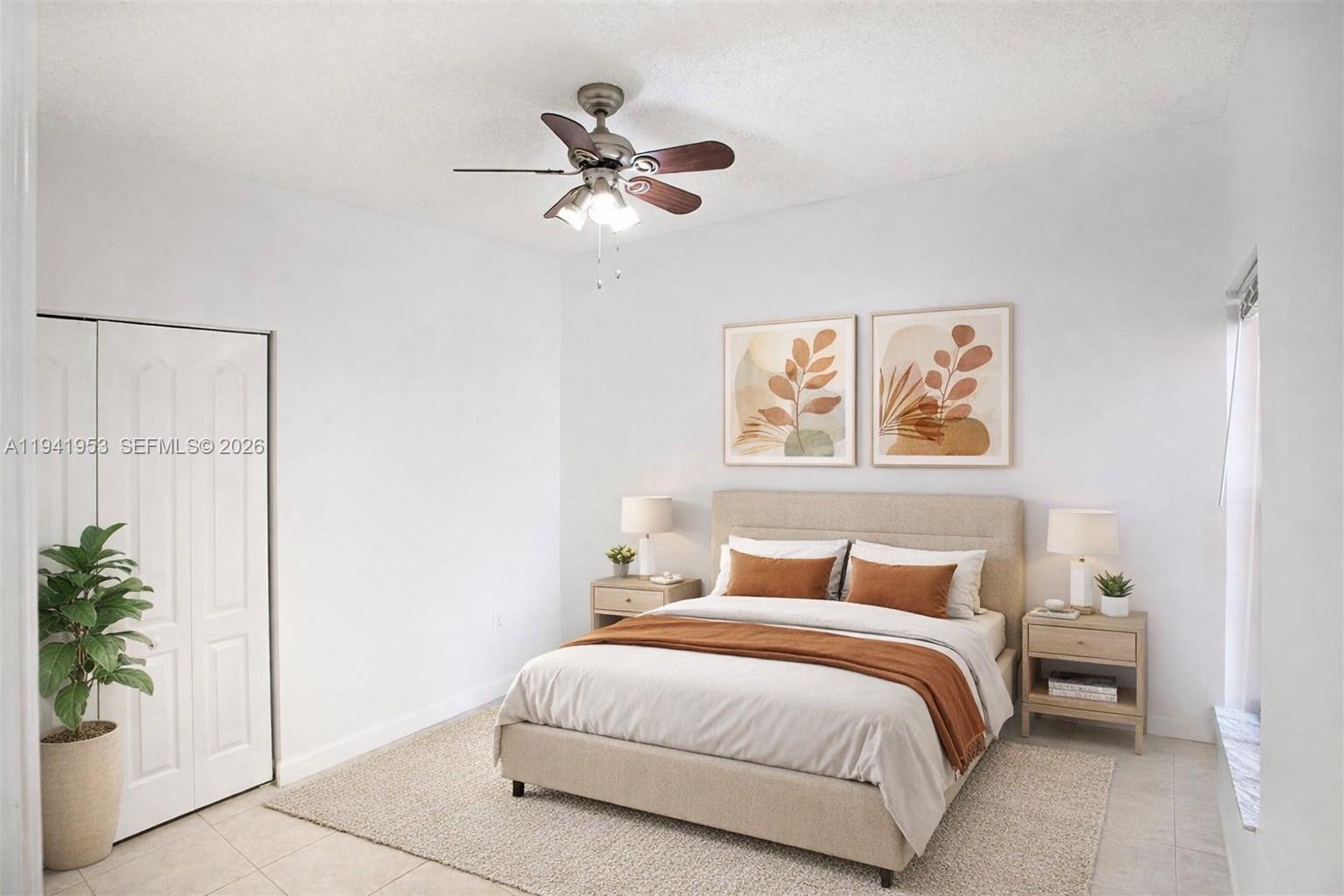 16222 Southwest 102nd Terrace Miami, FL 33196 - Photo 25 of 32 a bedroom with a bed and a painting on the wall