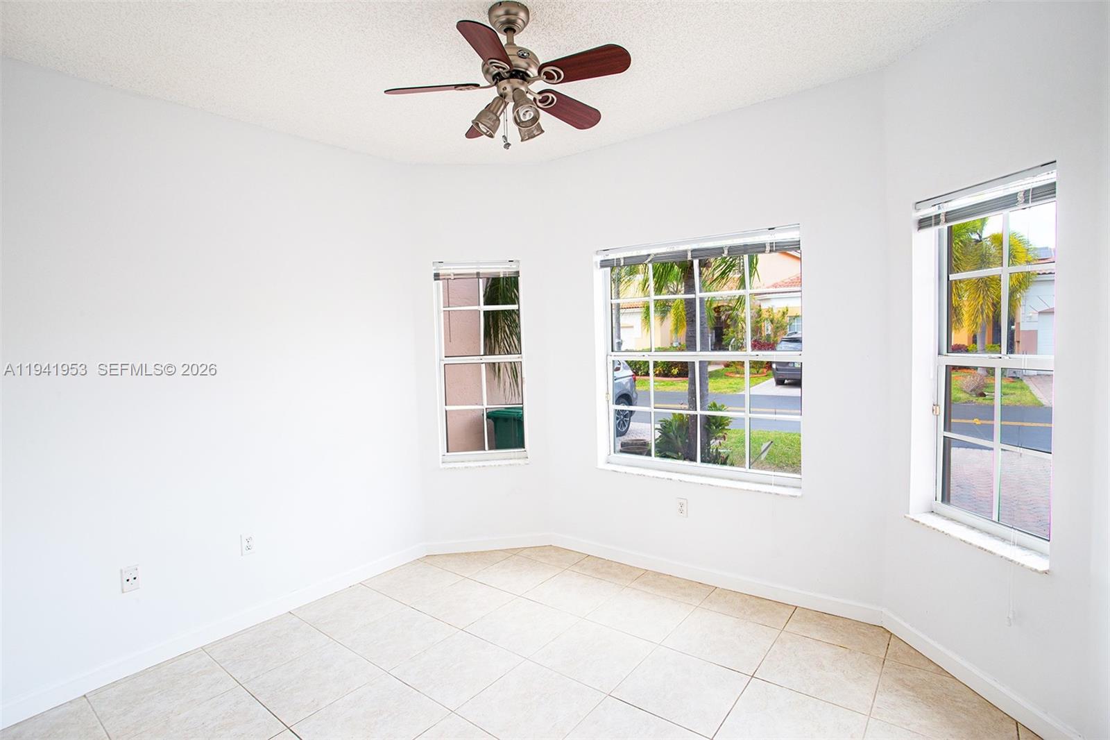 16222 Southwest 102nd Terrace Miami, FL 33196 - Photo 27 of 32 a view of an empty room with a window