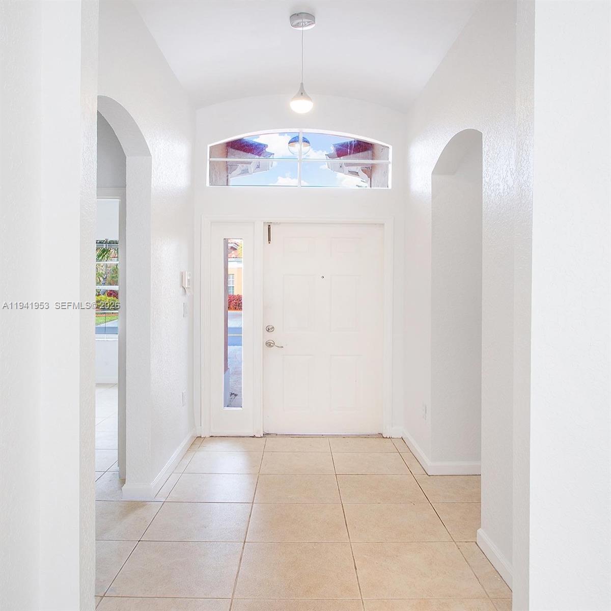 16222 Southwest 102nd Terrace Miami, FL 33196 - Photo 3 of 32 a view of a room with cabinet and chandelier