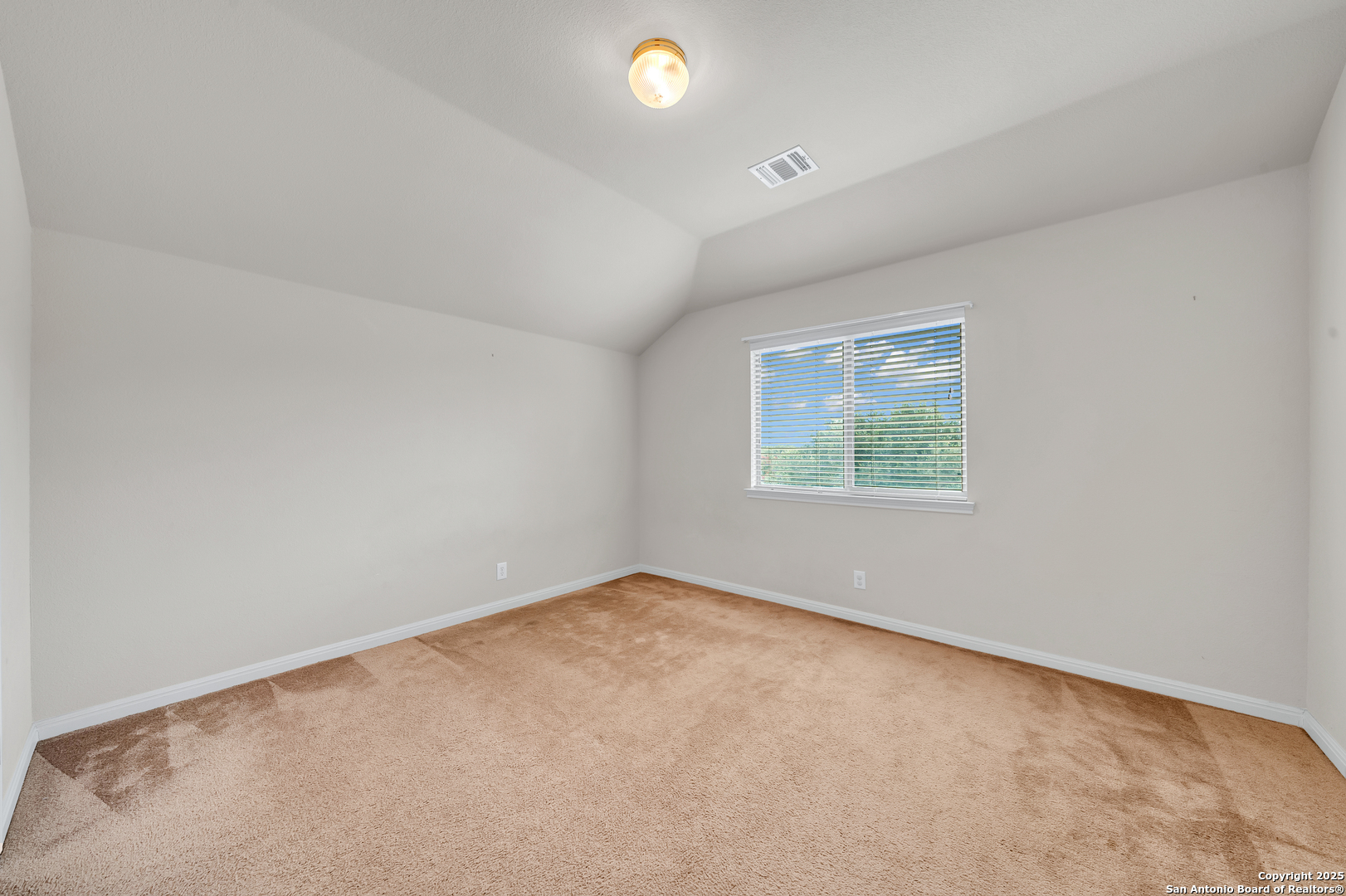 9243 McCafferty Drive Helotes, TX 78023 - Photo 24 of 40 an empty room with windows