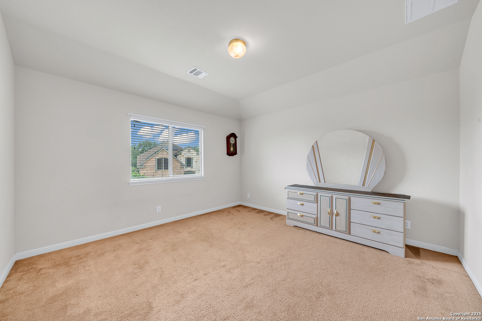 9243 McCafferty Drive Helotes, TX 78023 - Photo 25 of 40 an empty room with windows