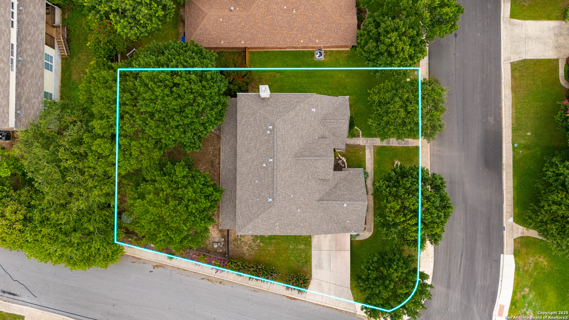 9243 McCafferty Drive Helotes, TX 78023 - Photo 32 of 40 an aerial view of a house with a garden and yard