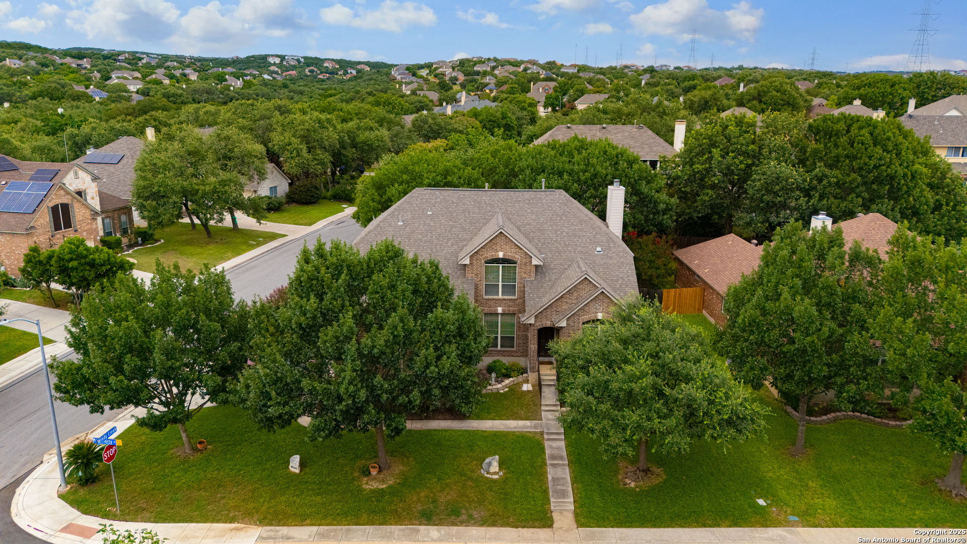 9243 McCafferty Drive Helotes, TX 78023 - Photo 40 of 40 an aerial view of a house with a garden and lake view