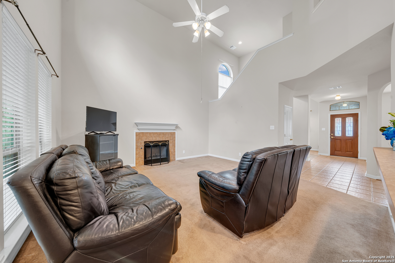 9243 McCafferty Drive Helotes, TX 78023 - Photo 6 of 40 a living room with furniture and a fireplace