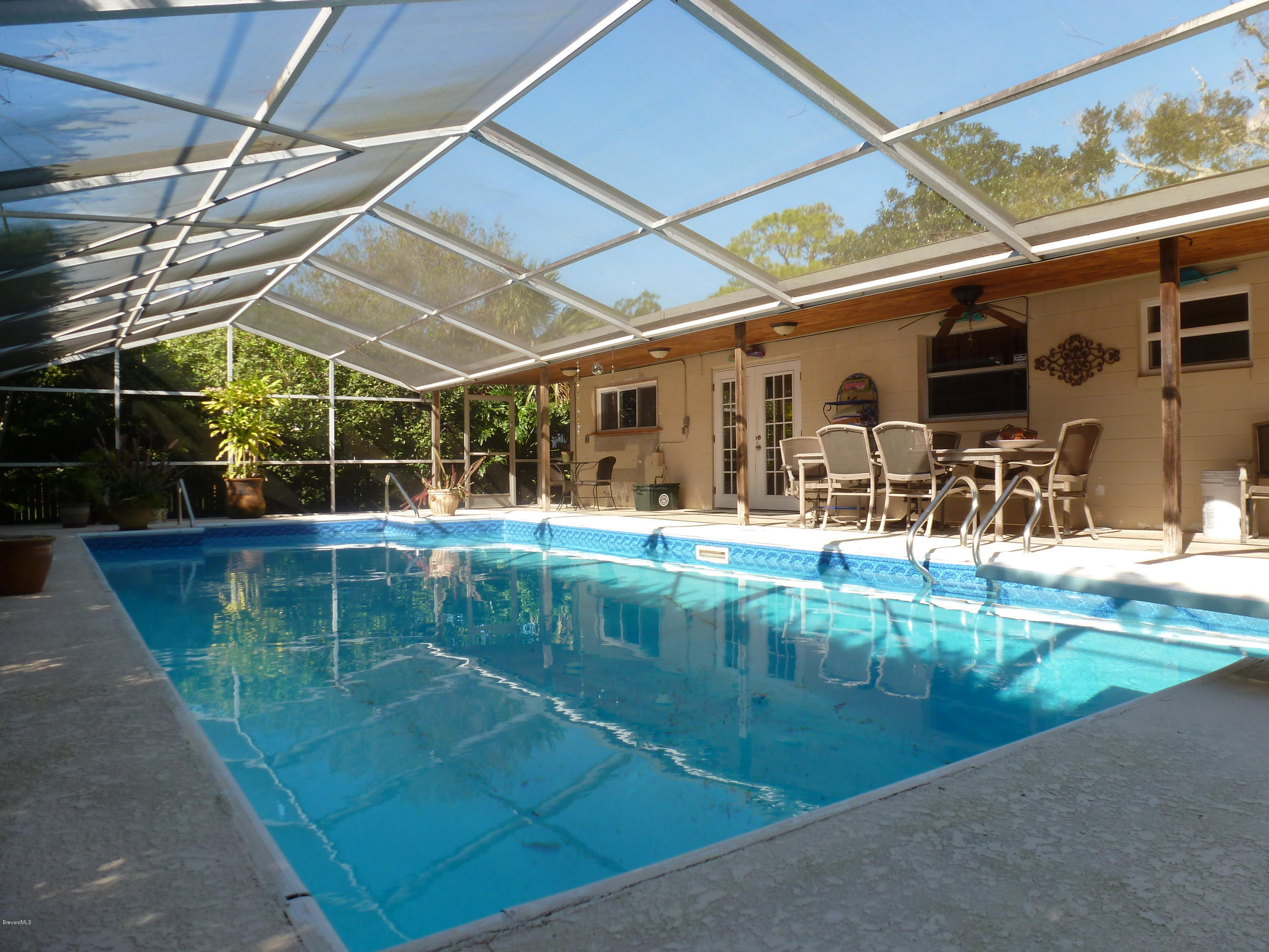 941 Lexington Road Rockledge, FL 32955 - Photo 15 of 16 HUGE Screened Lanai