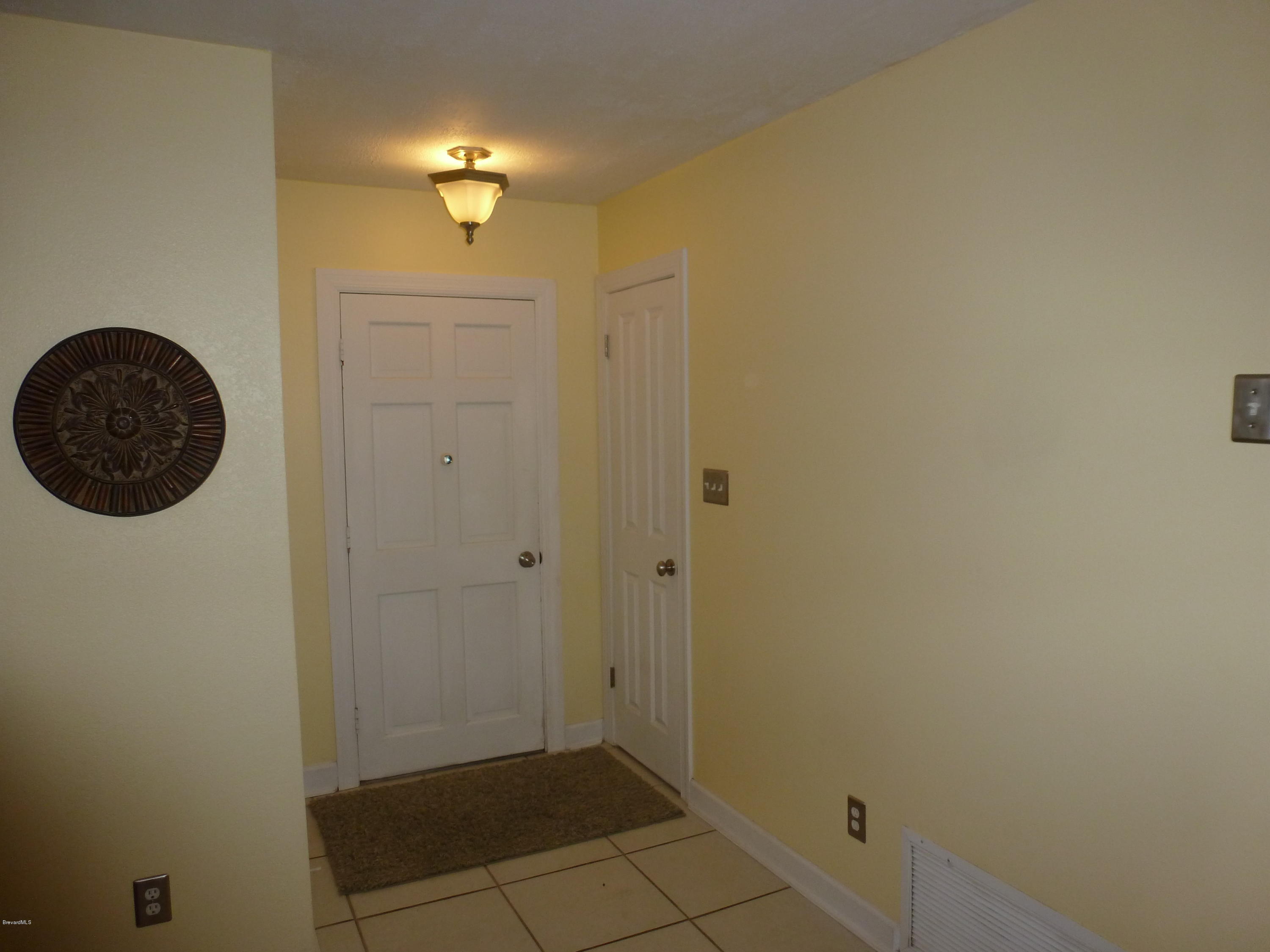 941 Lexington Road Rockledge, FL 32955 - Photo 3 of 16 Tiled Foyer Greets You