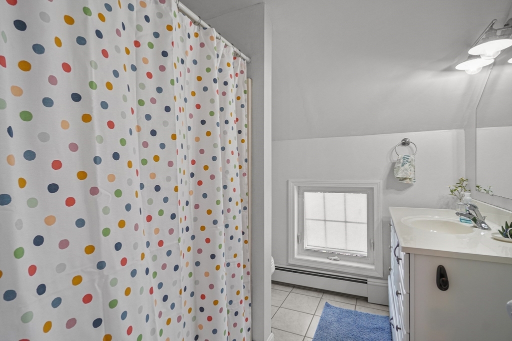 249 Baird Street Fall River, MA 02721 - Photo 17 of 23 a bathroom with a sink and a mirror