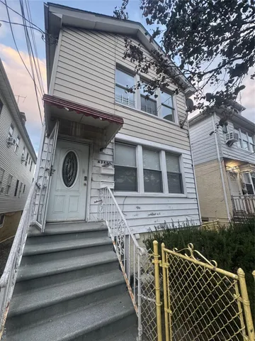 a view of a house with wooden stairs