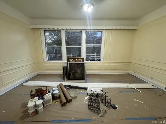 a room with wooden floor and furniture