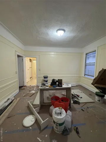 a room with furniture a rug and a window