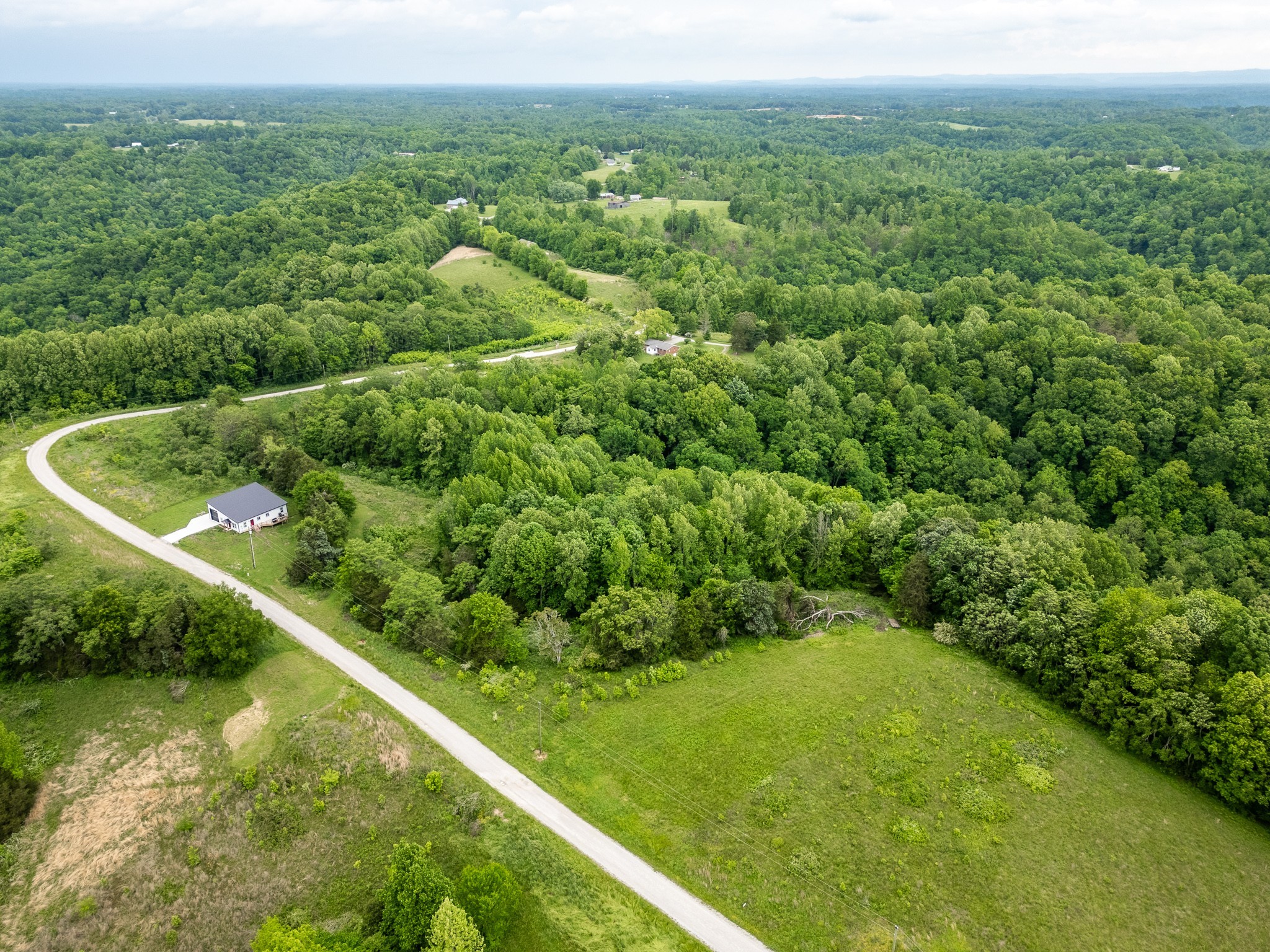 0 Lake Bluff Road Baxter, TN 38544 - Photo 8 of 13 a view of a green filed with trees in the background