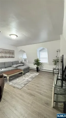 a white toilet sitting next to a shower curtain