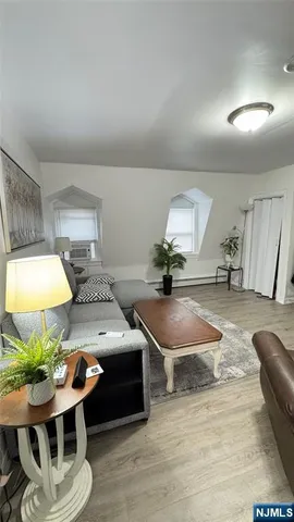 a kitchen with granite countertop a sink and cabinets