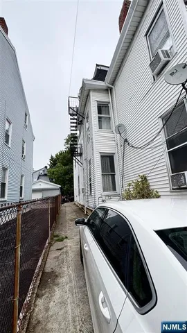 a view of a white house with a sink and dishwasher