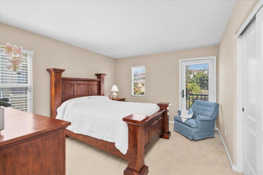 838 Luminara Way San Marcos, CA 92078 - Photo 39 of 54 a bed room with a bed and a couch