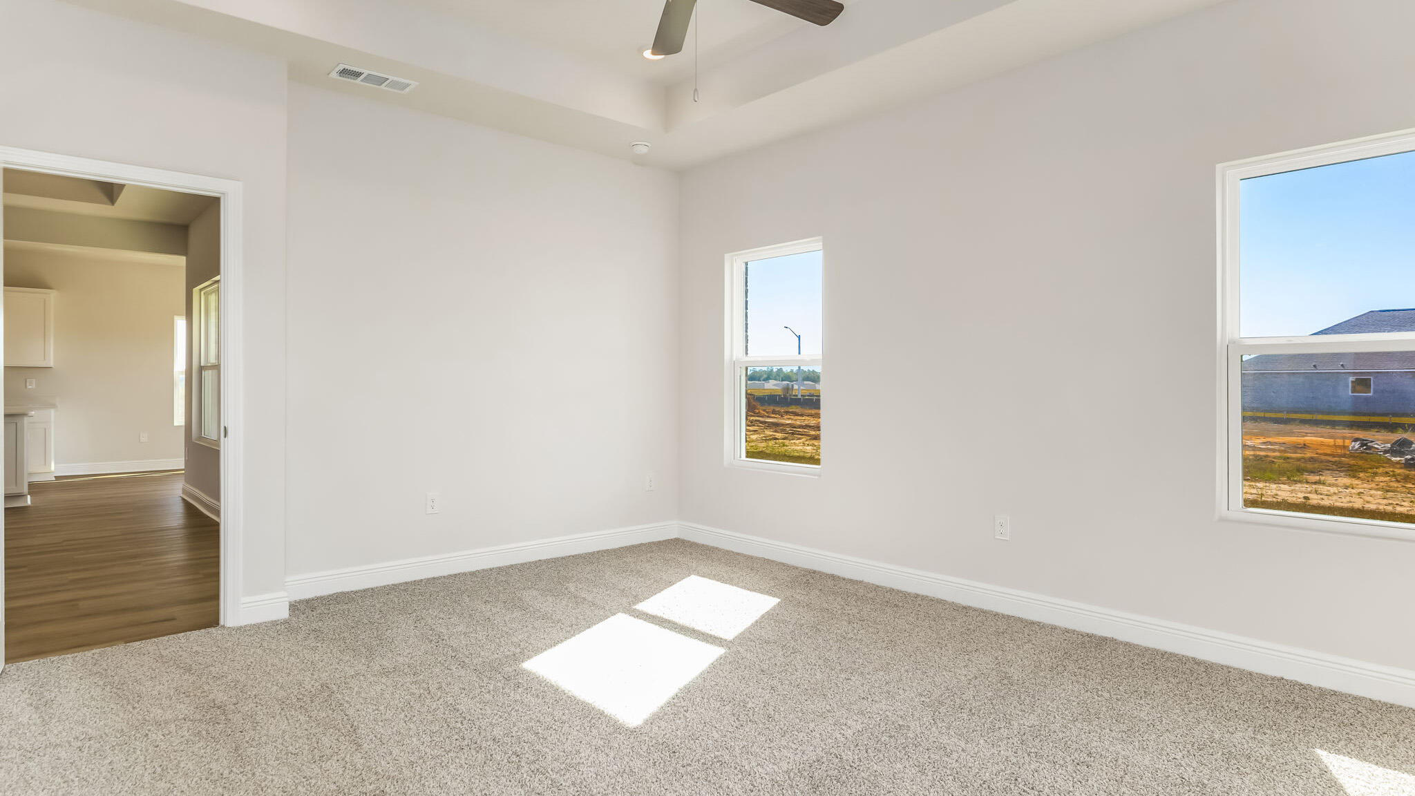 5619 Thatcher Road Crestview, FL 32539 - Photo 13 of 32 an empty room with a window and a ceiling fan