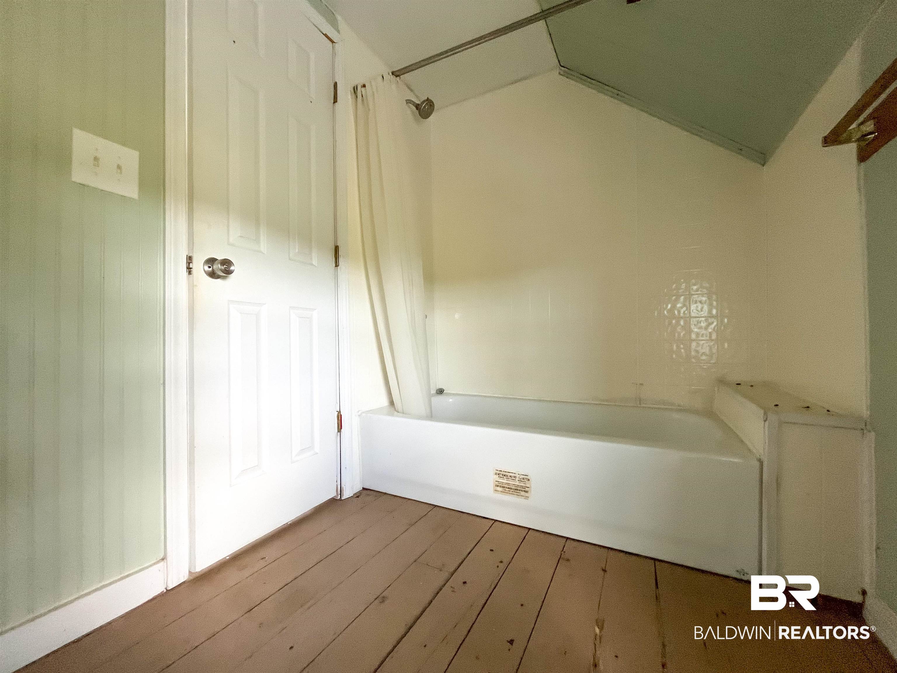 12956 Bender Road Foley, AL 36535 - Photo 31 of 46 Bathroom with shower / tub combo, lofted ceiling, and wood-type flooring