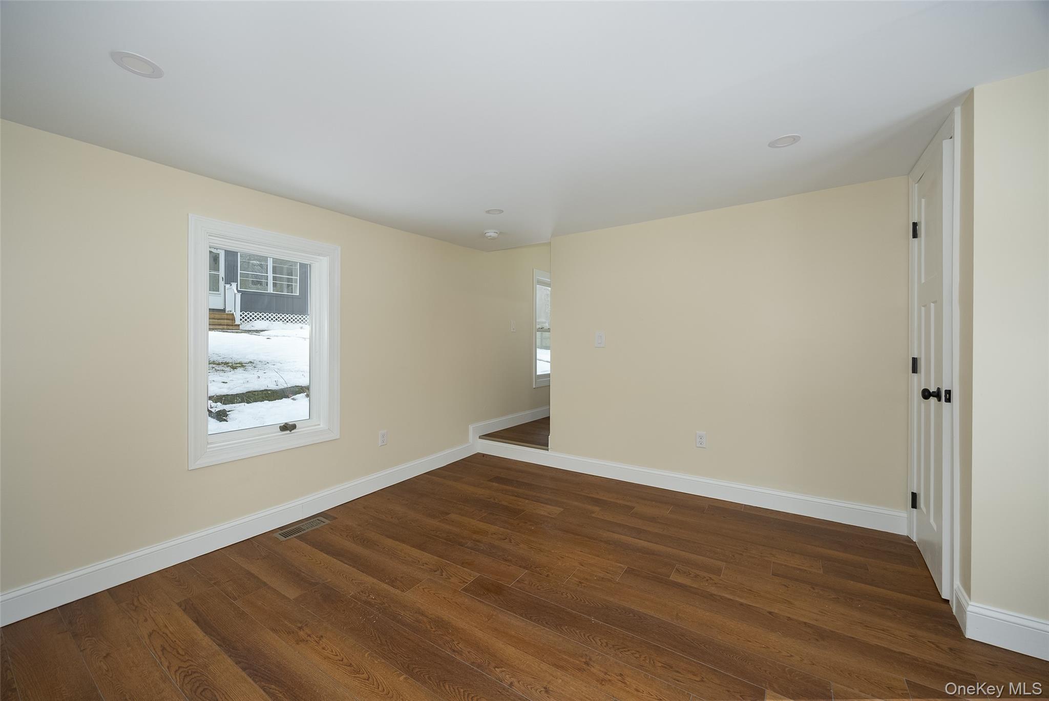534-536 River Road Rhinebeck, NY 12572 - Photo 15 of 37 a view of an empty room with wooden floor and a window