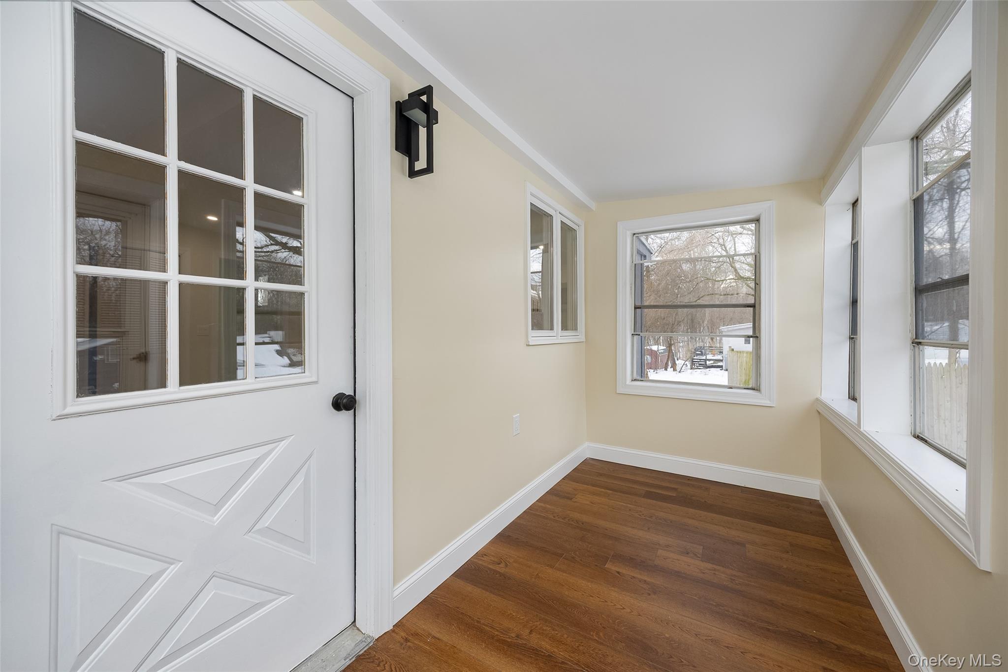 534-536 River Road Rhinebeck, NY 12572 - Photo 20 of 37 a view of an empty room with wooden floor and a window