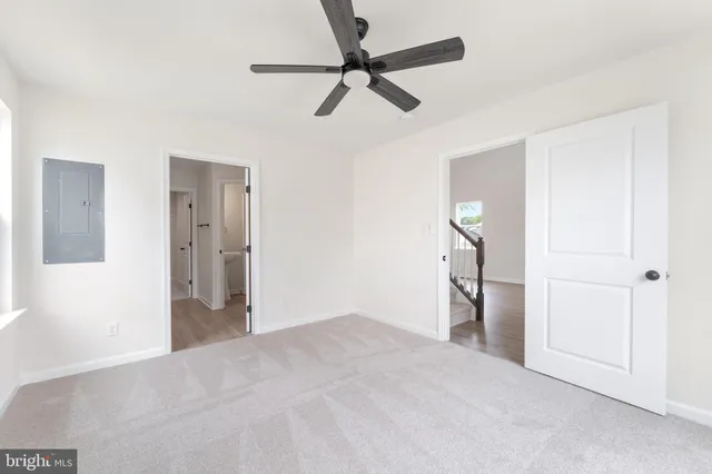 a view of empty room with ceiling fan