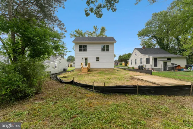 a swimming pool view with a seating space
