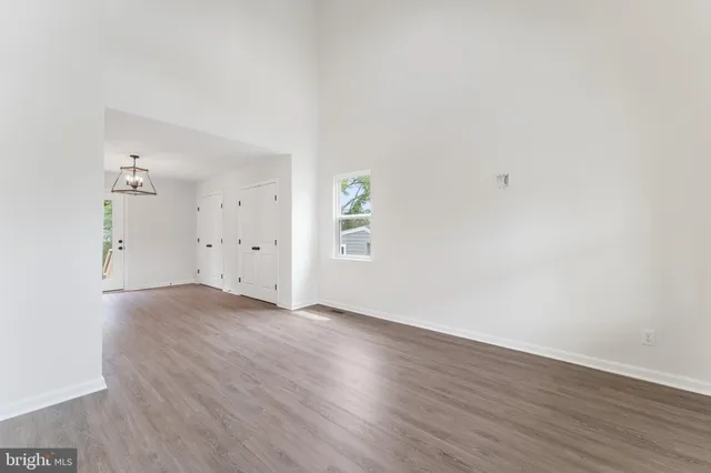 an empty room with wooden floor