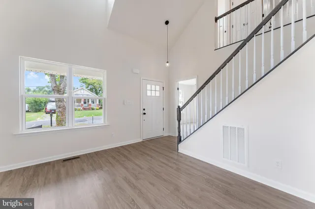 a view of entryway with wooden floor