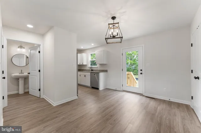a view of a kitchen with a sink dishwasher and a microwave oven