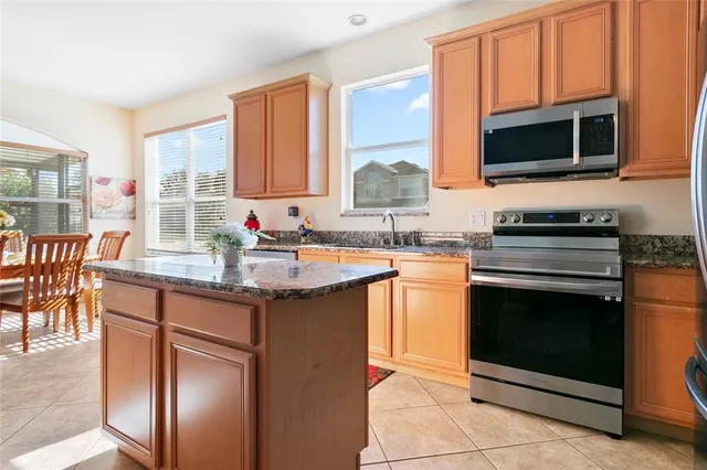 a view of a dining room with furniture and a window