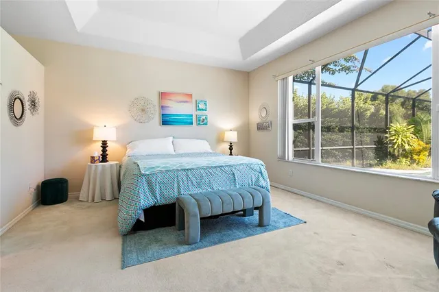 a bedroom with a bed and flat screen tv