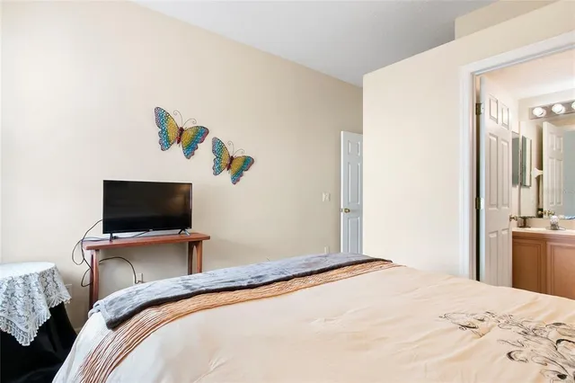 a bathroom with a sink vanity mirror and toilet