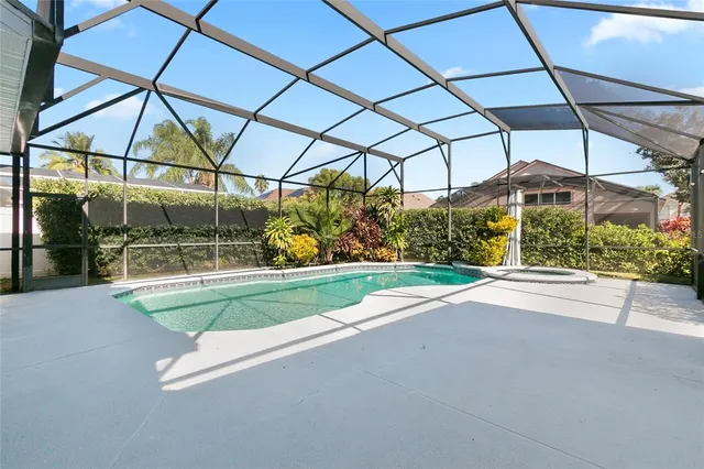 a view of a swimming pool with a patio