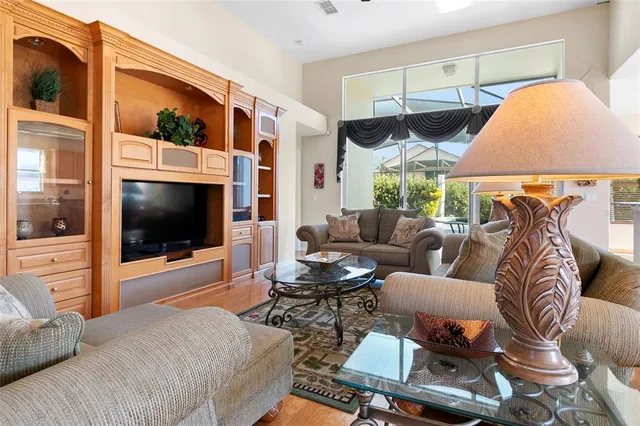 a living room with furniture kitchen and a fireplace