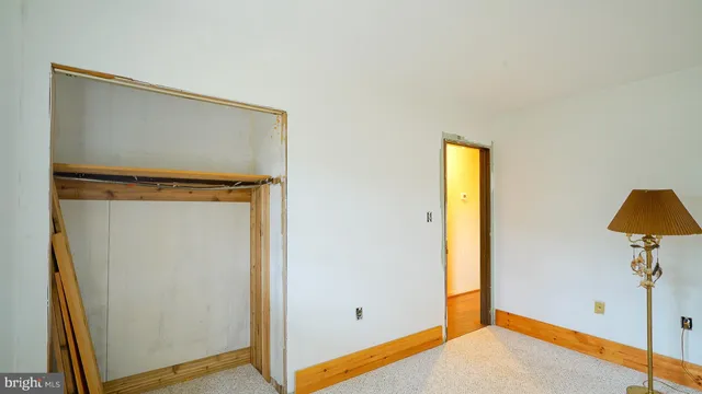 a view of front door with wooden floor