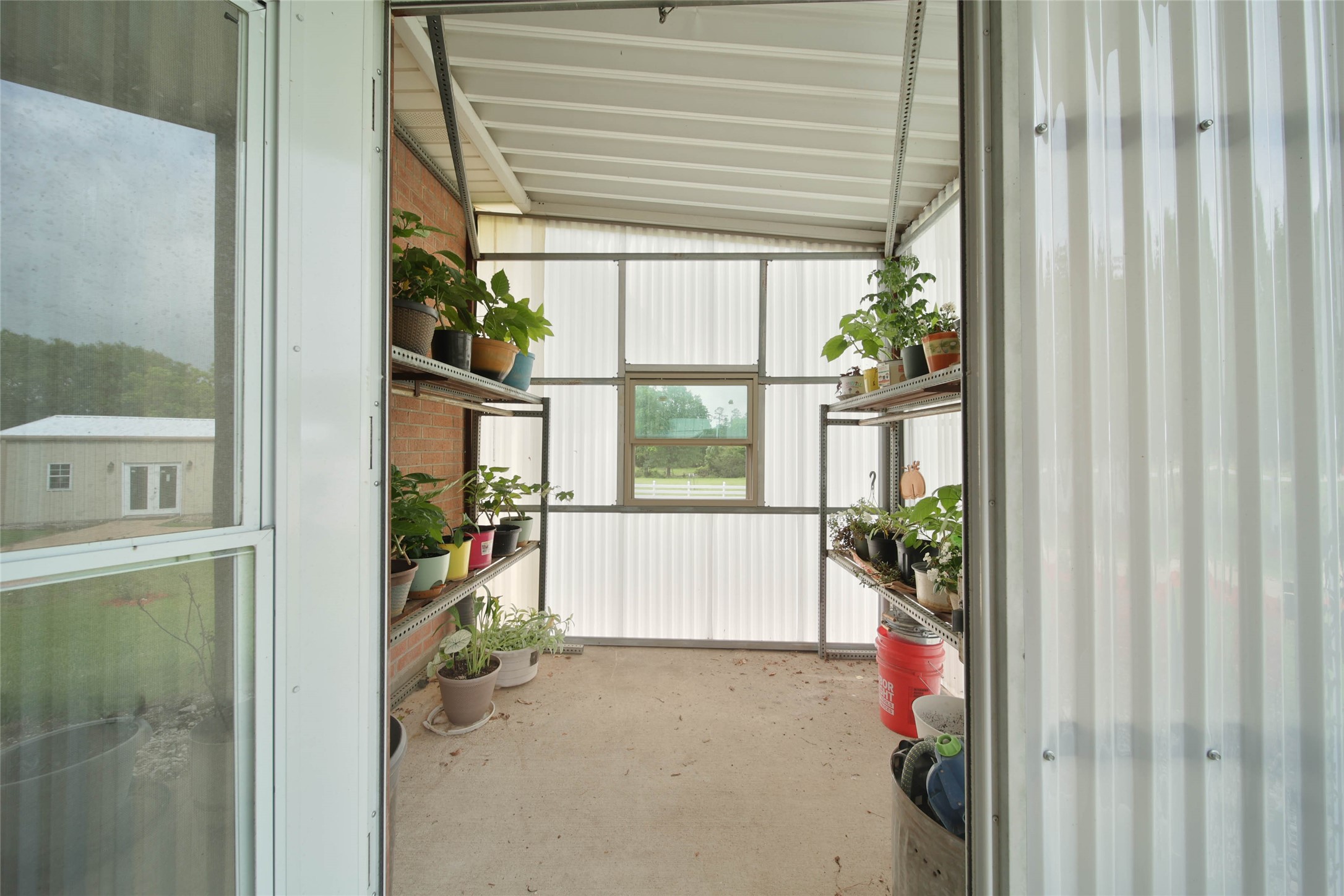 128 Duke Road Bedias, TX 77831 - Photo 35 of 50 Green House - Attached to Back Patio