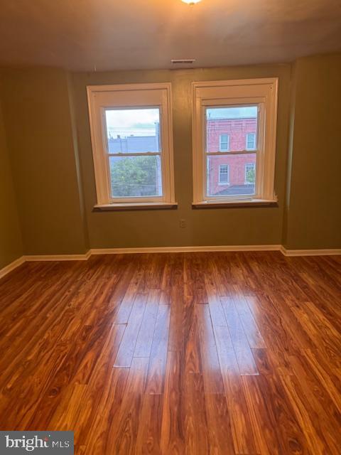 611 North 32nd Street Philadelphia, PA 19104 - Photo 14 of 15 an empty room with wooden floor and windows