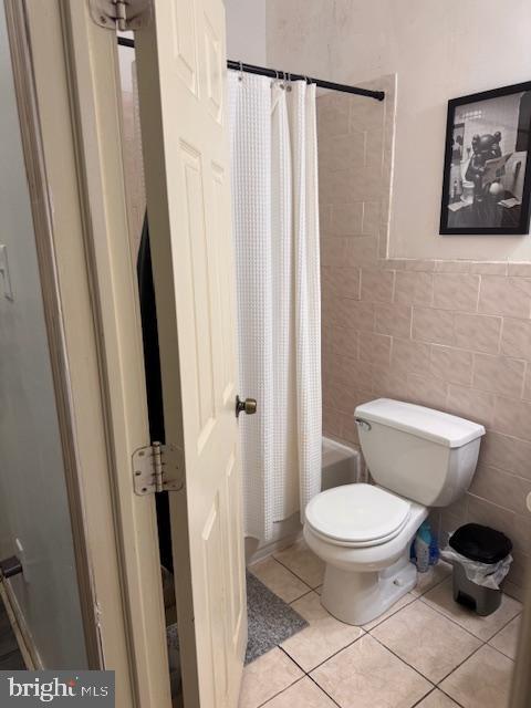 611 North 32nd Street Philadelphia, PA 19104 - Photo 6 of 15 a white toilet sitting next to a shower curtain