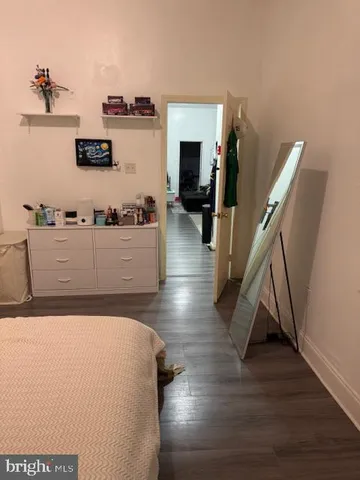 a living room with hard wood flooring and a wooden floor