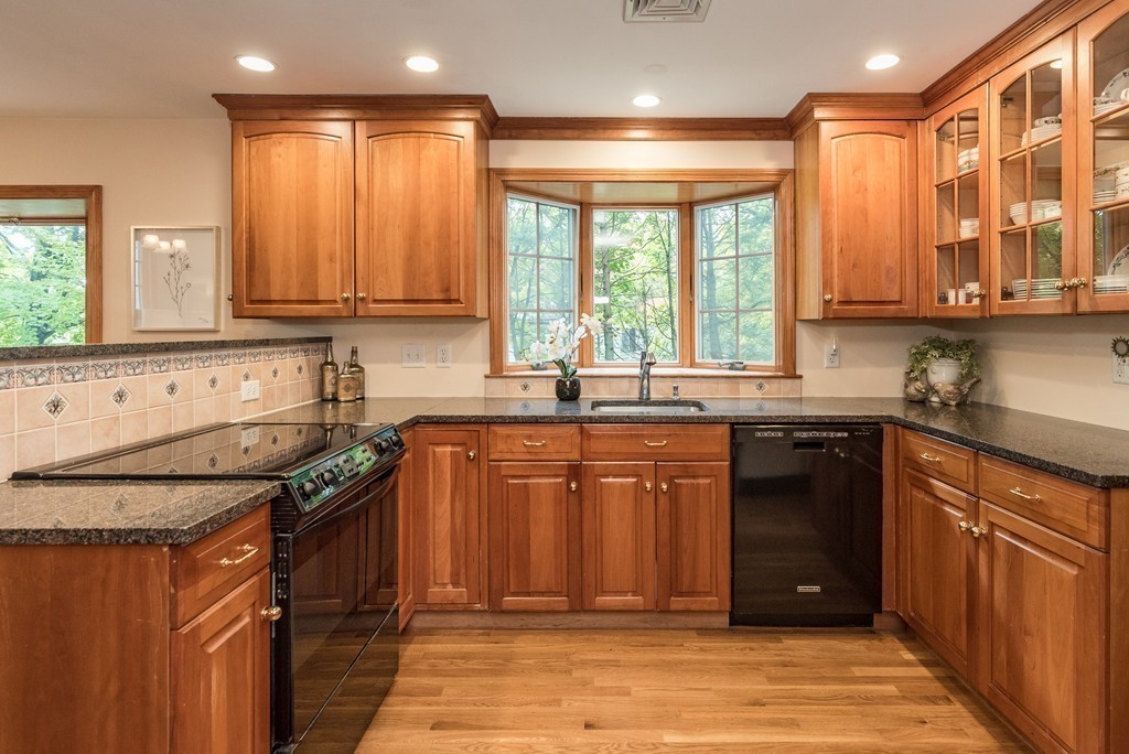 41 Watertown Street Lexington, MA 02421 - Photo 2 of 23 a kitchen with stainless steel appliances granite countertop a sink stove and cabinets