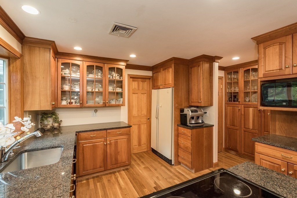 41 Watertown Street Lexington, MA 02421 - Photo 3 of 23 a kitchen with stainless steel appliances granite countertop a refrigerator and a stove top oven