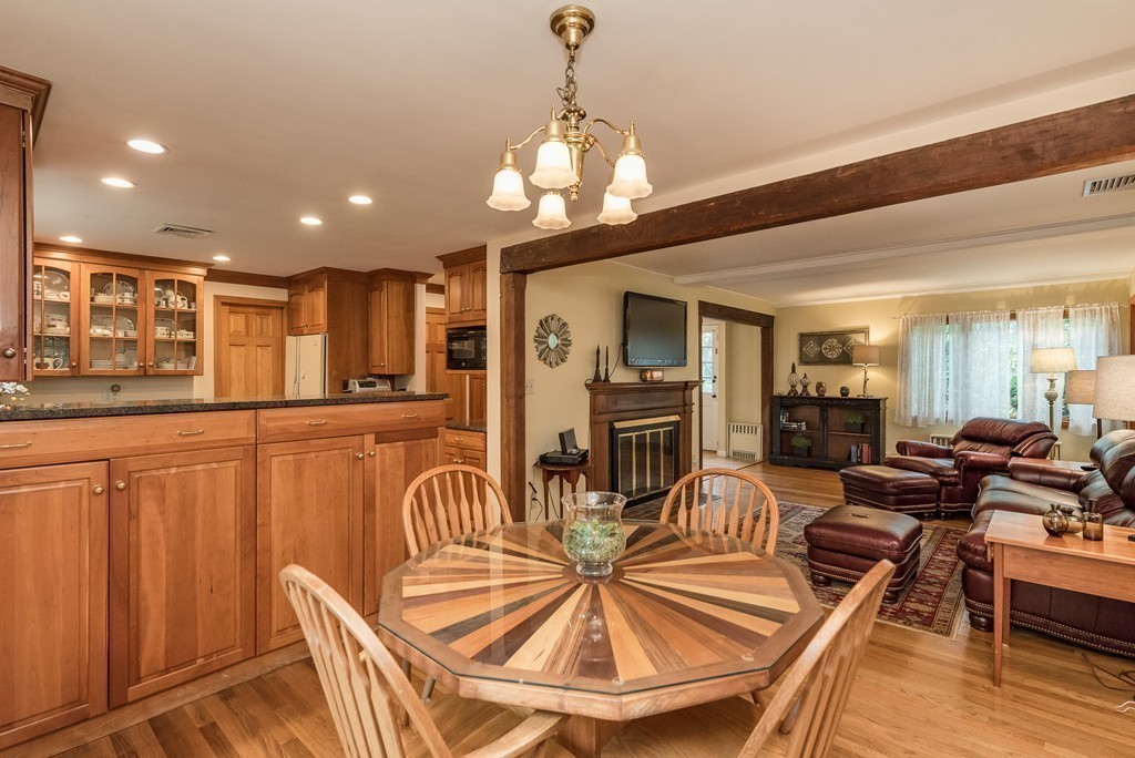 41 Watertown Street Lexington, MA 02421 - Photo 4 of 23 a view of a dining room with furniture a chandelier and wooden floor