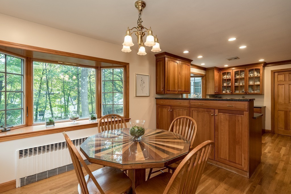 41 Watertown Street Lexington, MA 02421 - Photo 5 of 23 a dining room with furniture a chandelier and wooden floor