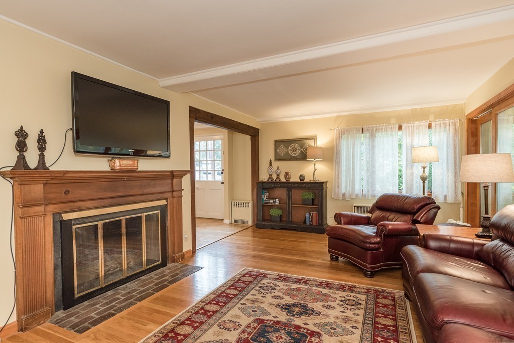 41 Watertown Street Lexington, MA 02421 - Photo 10 of 23 a living room with furniture and a flat screen tv