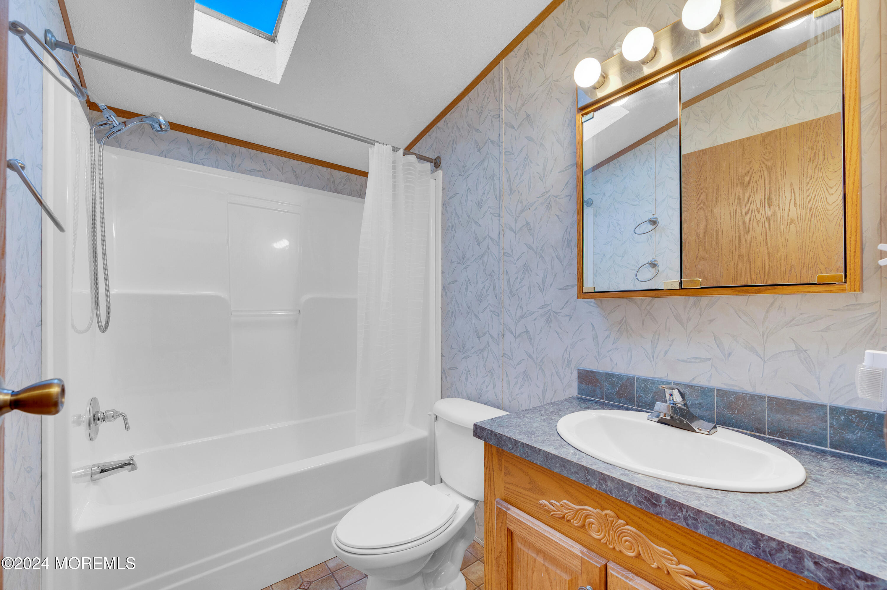 2 Baltimore Avenue Manahawkin, NJ 08050 - Photo 13 of 20 a bathroom with a granite countertop sink toilet and shower