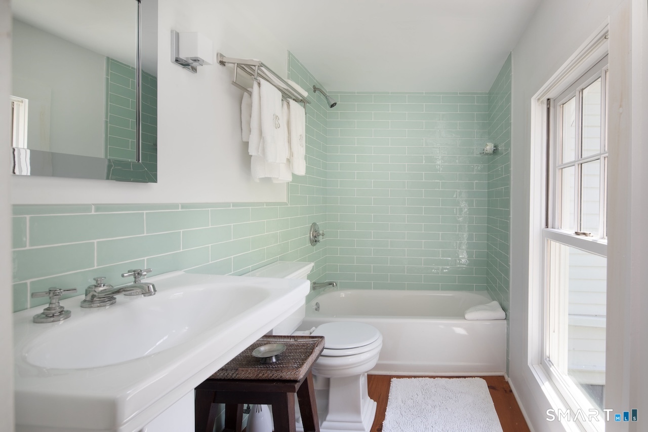 329 Housatonic River Road Salisbury, CT 06031 - Photo 26 of 32 a bathroom with a sink a toilet and shower