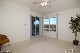 10751 Halfmoon Shoal Road, Unit 201 Bonita Springs, FL 34135 - Photo 5 of 8 a view of an empty room with a window