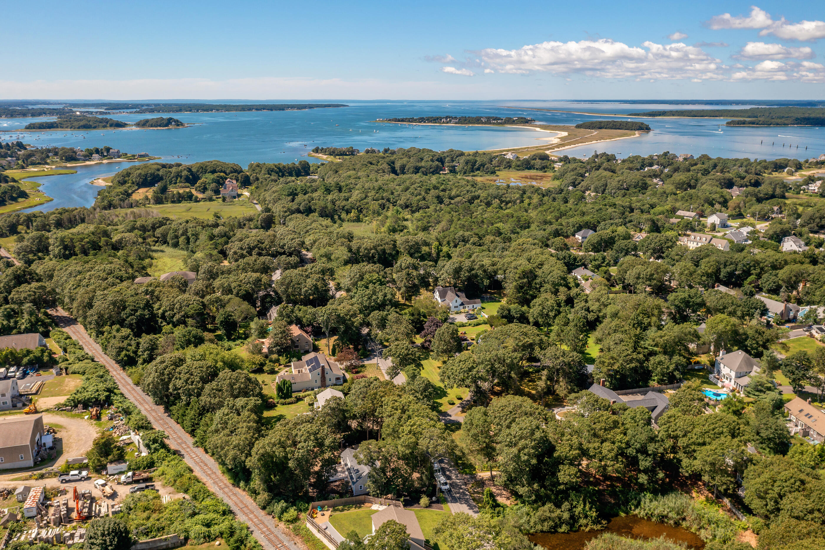 53 Monument Neck Road Bourne, MA 02532 - Photo 11 of 44 an aerial view of a houses with a lake view