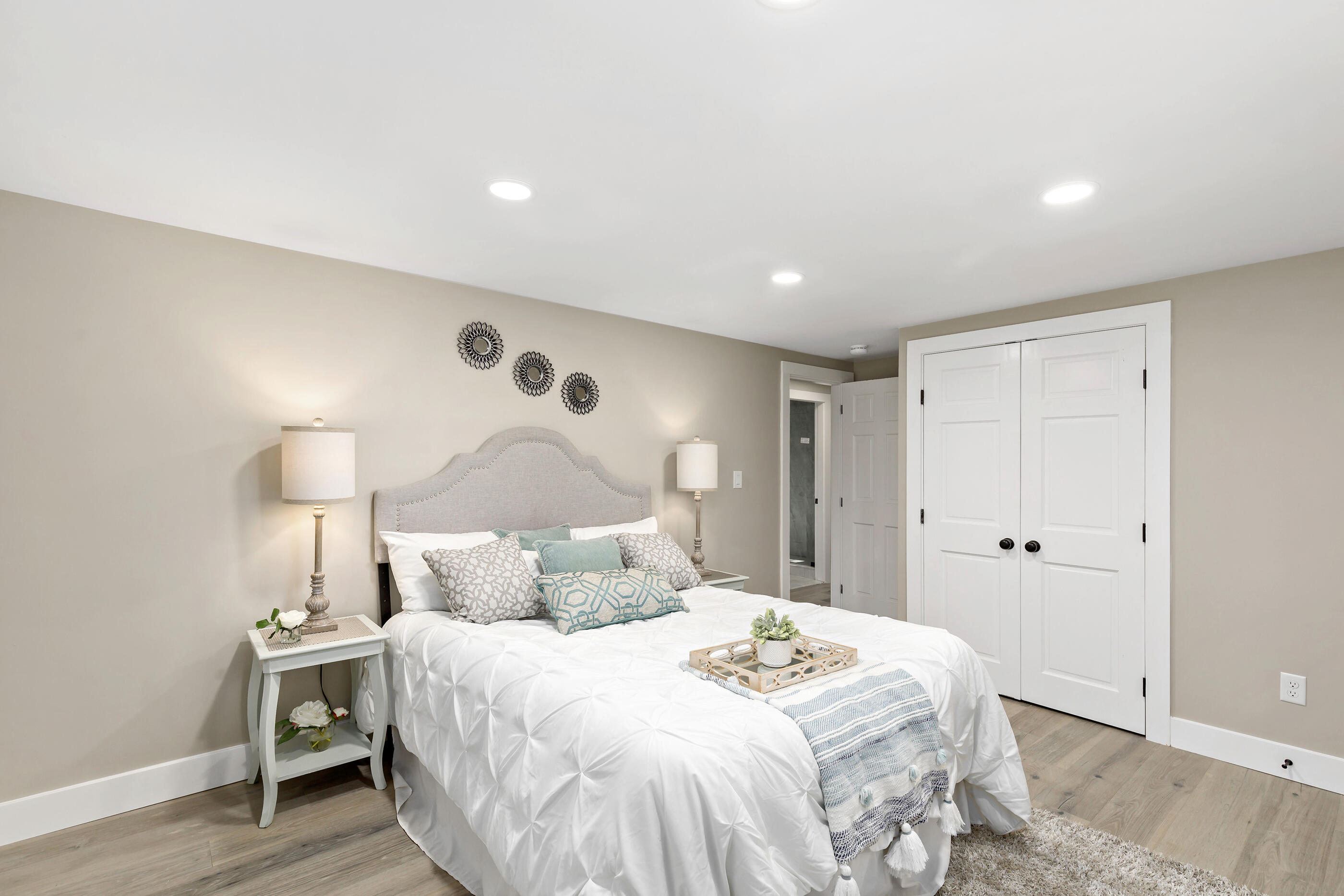 53 Monument Neck Road Bourne, MA 02532 - Photo 27 of 44 a bedroom with a bed and a lamp