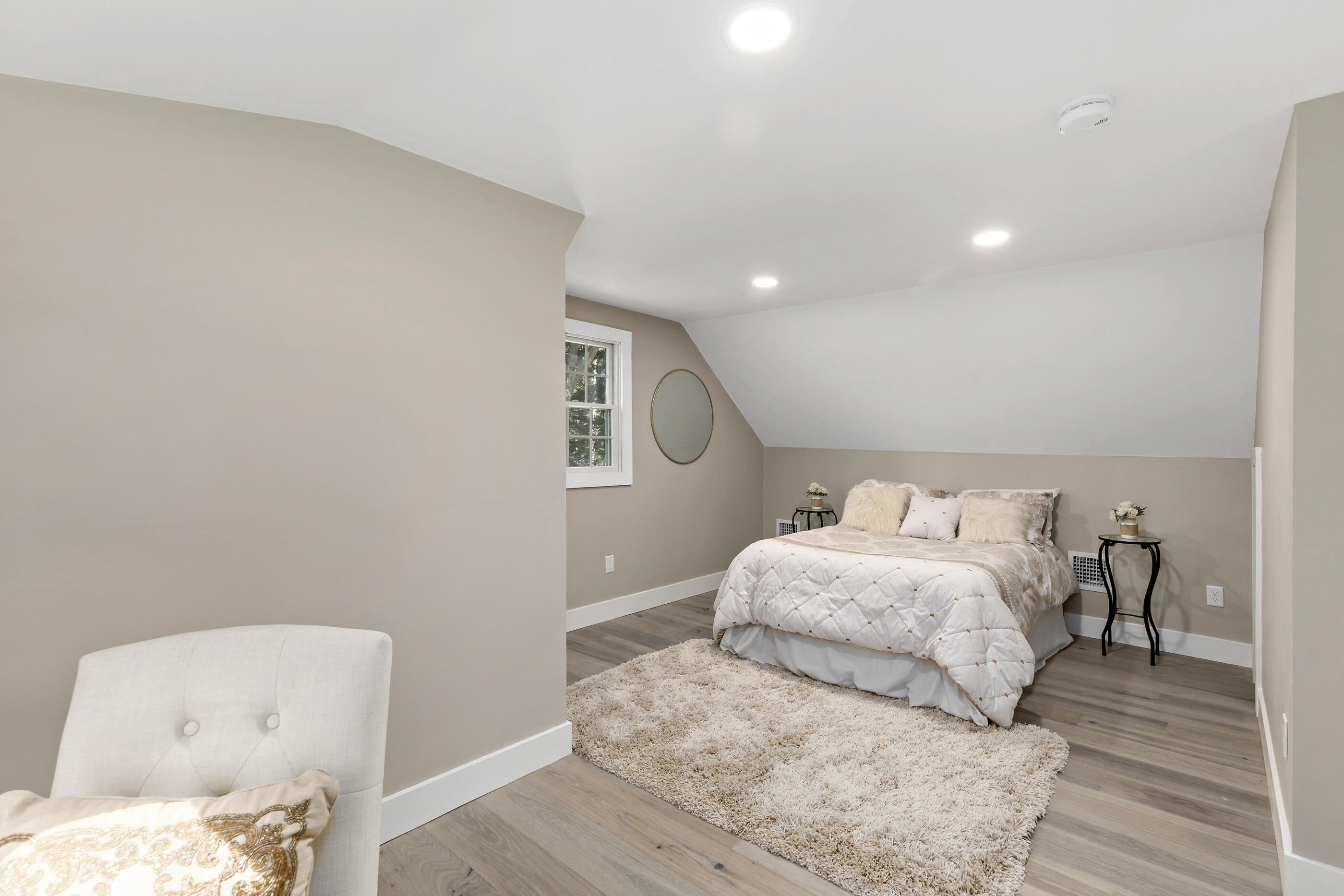53 Monument Neck Road Bourne, MA 02532 - Photo 37 of 44 a bedroom with a bed and wooden floor