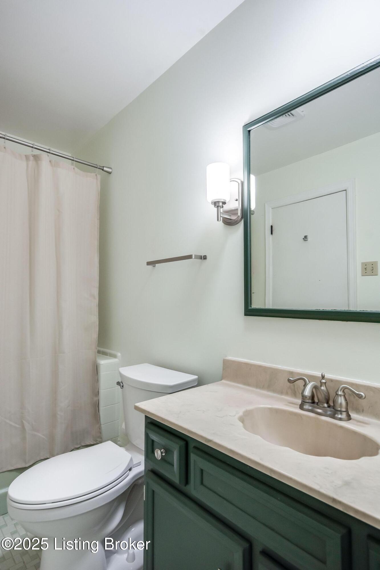9611 Fairground Road Louisville, KY 40291 - Photo 31 of 57 Full Bath #2 with tile flooring, new light fixture, tub and a new toilet.